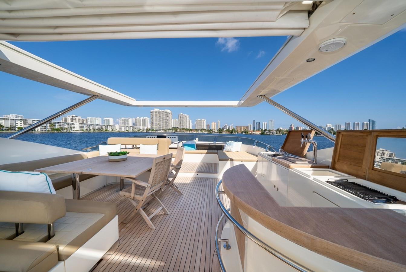 a room with a view of a city and a body of water aboard KAERU Yacht for Sale