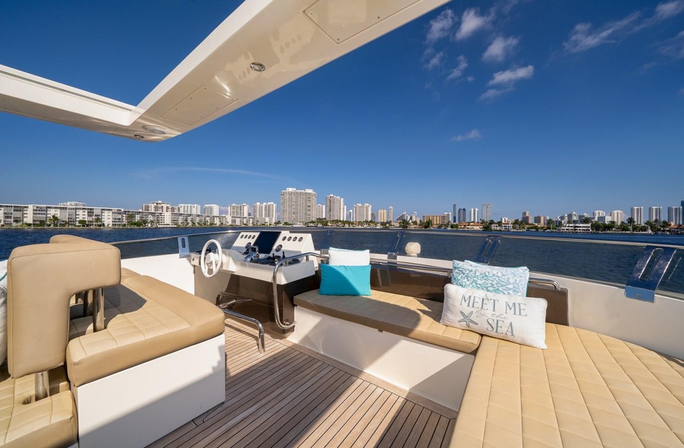 a deck with a view of a city and a body of water aboard KAERU Yacht for Sale