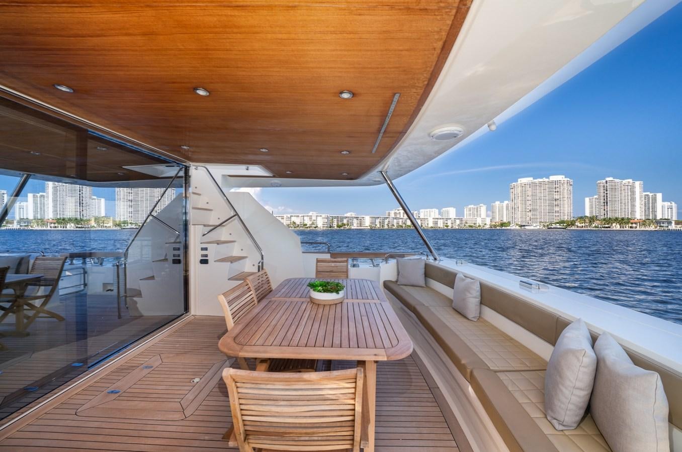 a deck with a view of a city and water aboard KAERU Yacht for Sale