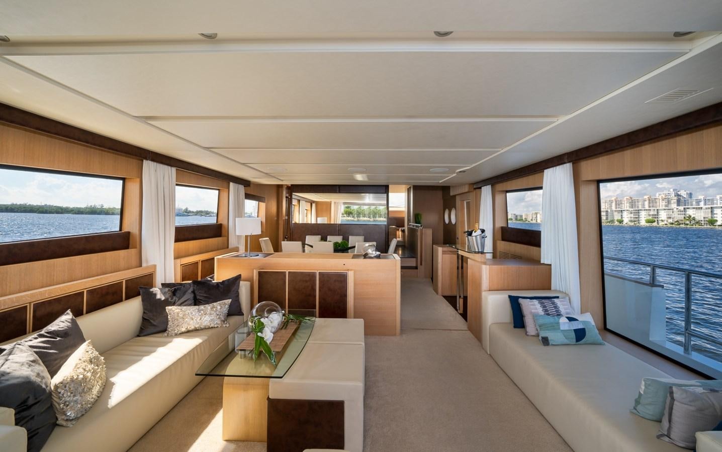 a living room with a large window aboard KAERU Yacht for Sale