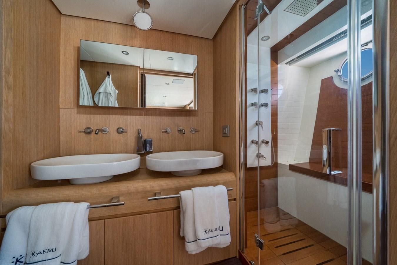 a bathroom with a sink and a mirror aboard KAERU Yacht for Sale