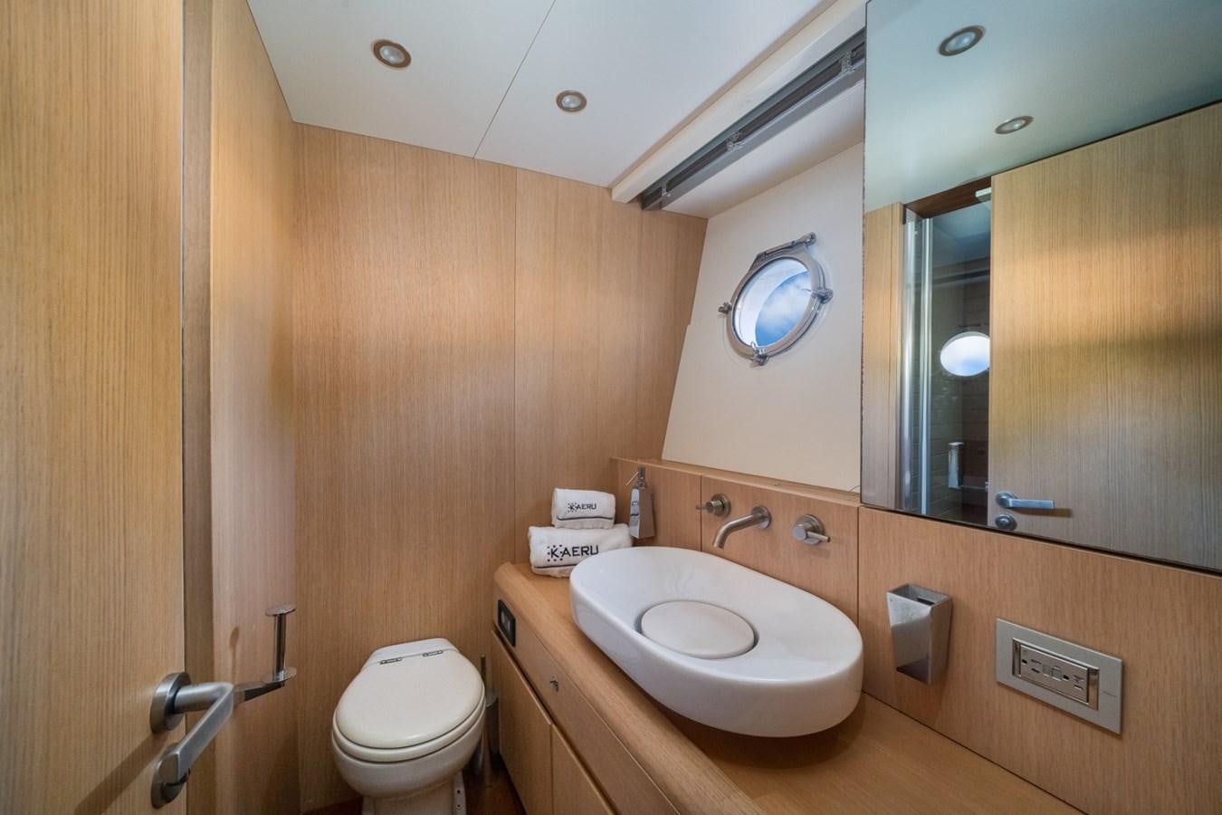 a bathroom with a sink and toilet aboard KAERU Yacht for Sale