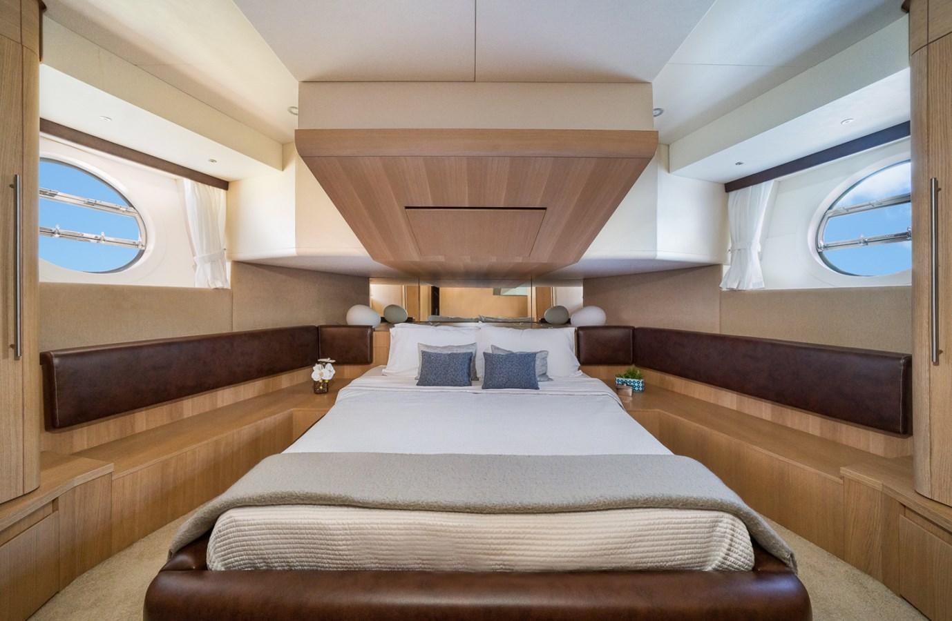 a room with a bed and a window aboard KAERU Yacht for Sale