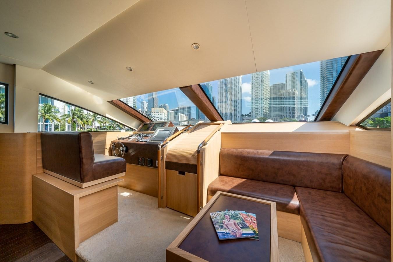 a living room with a couch and a table aboard KAERU Yacht for Sale