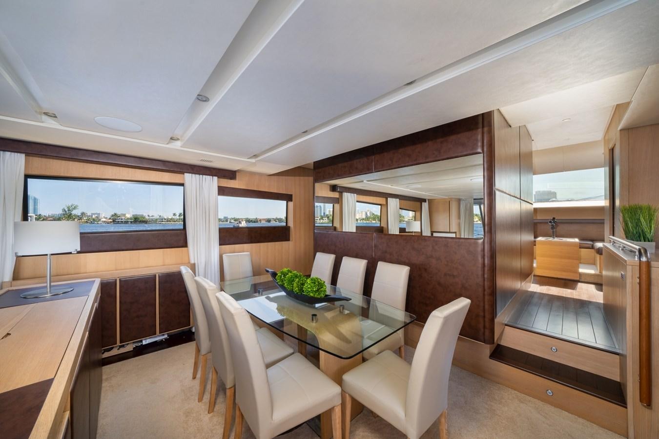 a room with a table chairs and a window aboard KAERU Yacht for Sale