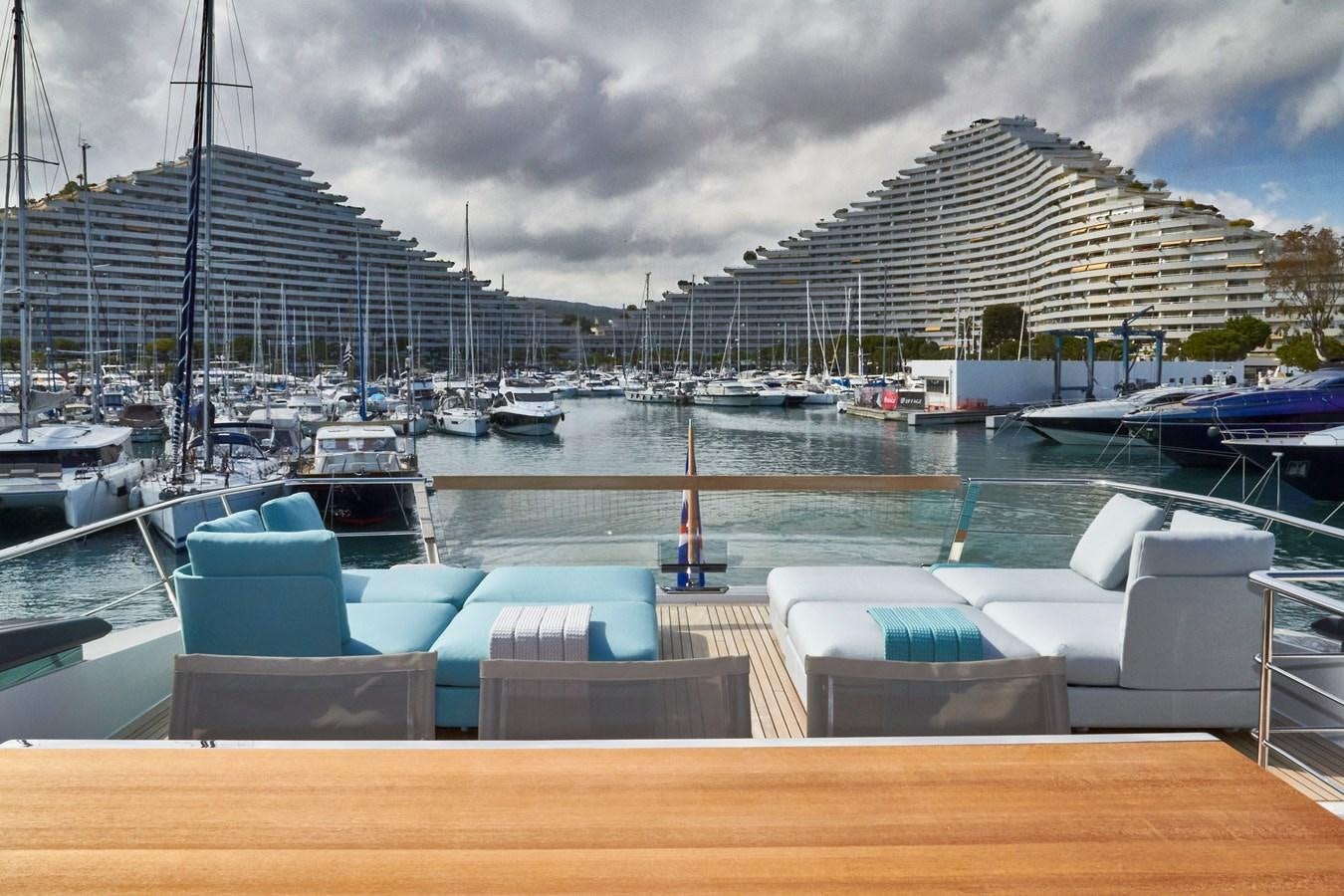 a boat dock with many boats aboard SL96A Yacht for Sale