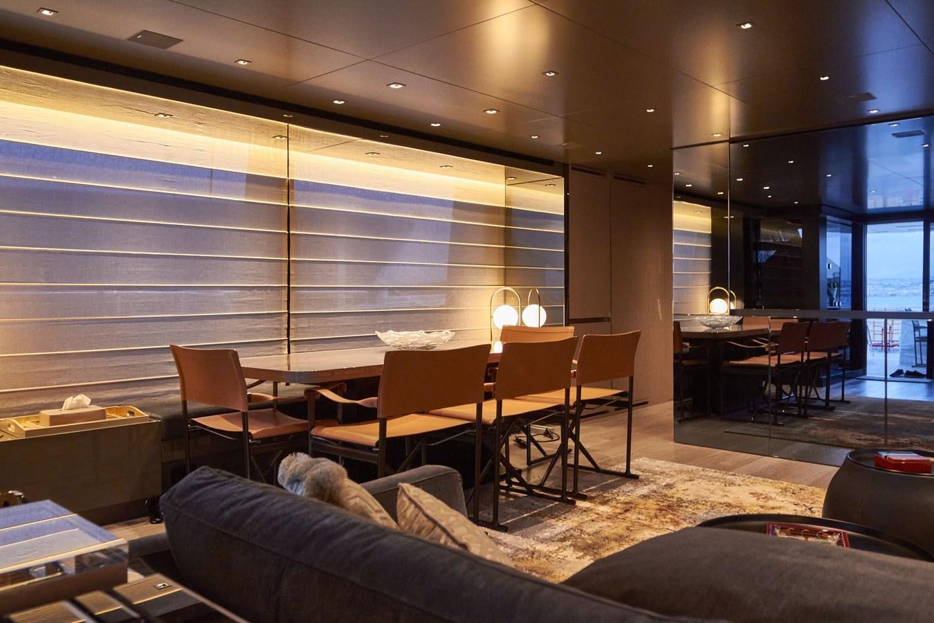 a room with a couch and a table and chairs aboard SL96A Yacht for Sale