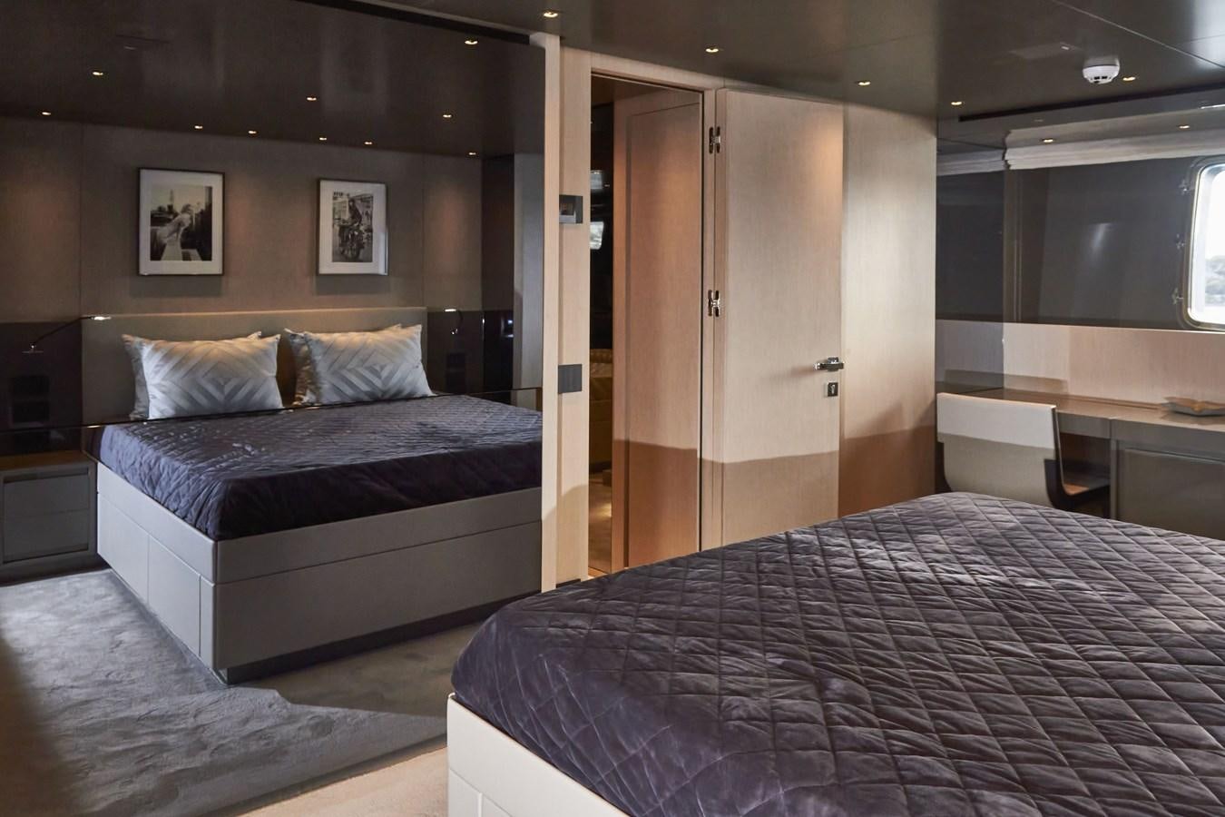 a room with a bed and a desk aboard SL96A Yacht for Sale