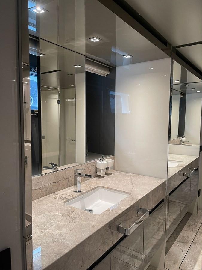a bathroom with a large mirror aboard SL96A Yacht for Sale
