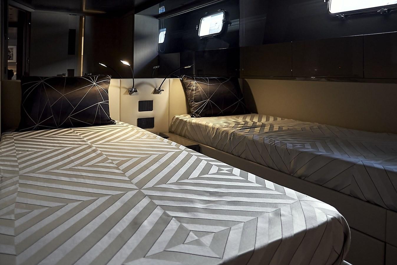a room with beds aboard SL96A Yacht for Sale