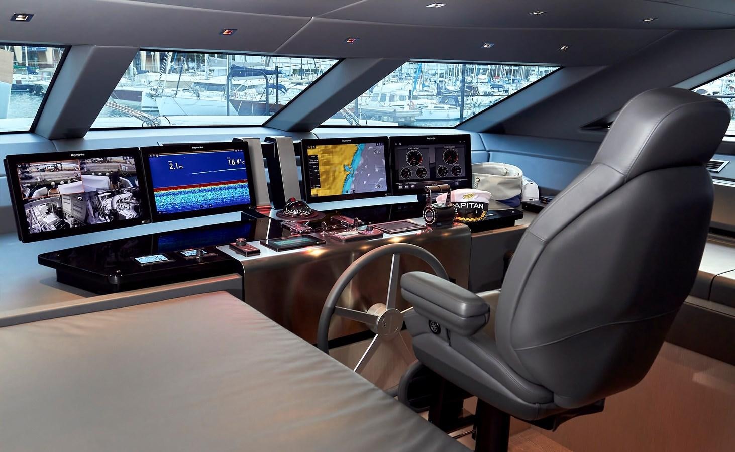 a room with computers and monitors aboard SL96A Yacht for Sale