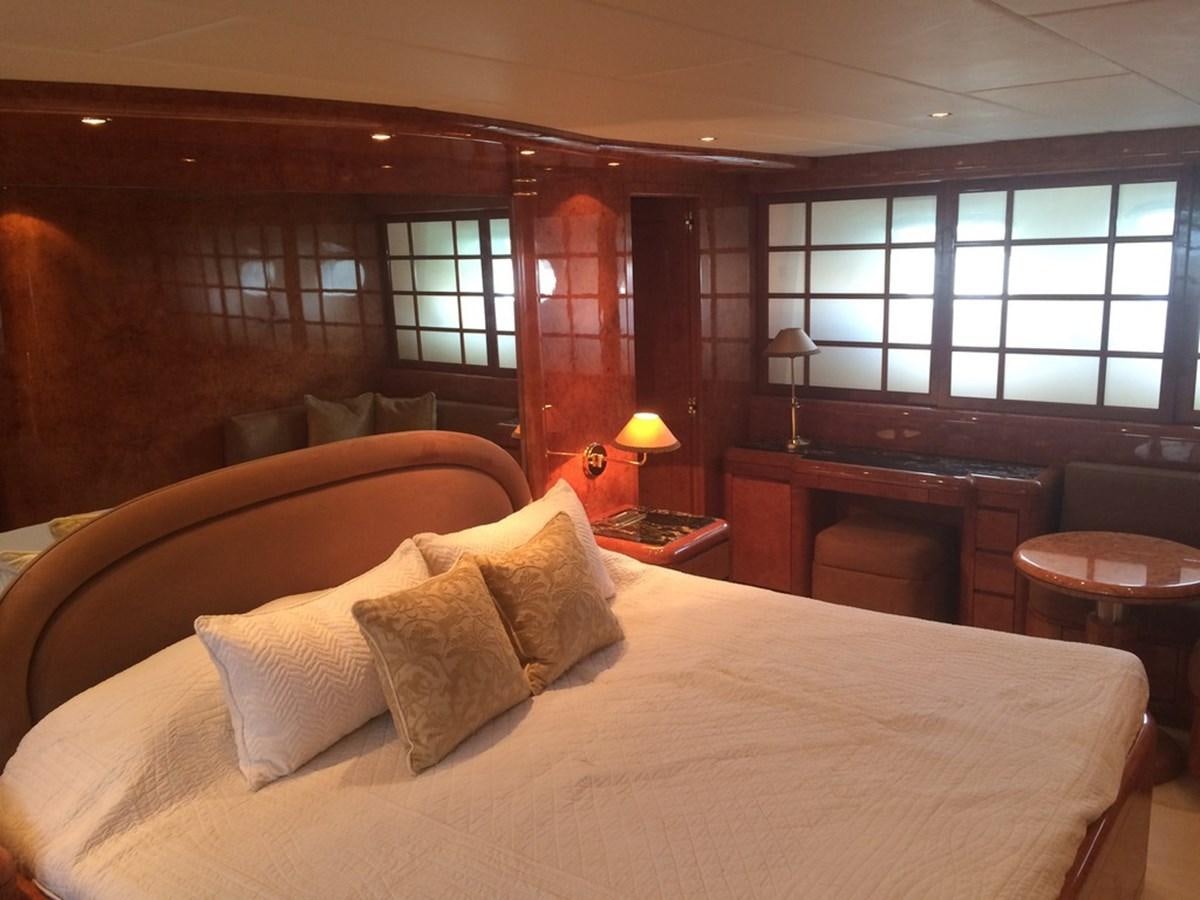 a large bed in a room aboard BIRD OF PREY  Yacht for Sale