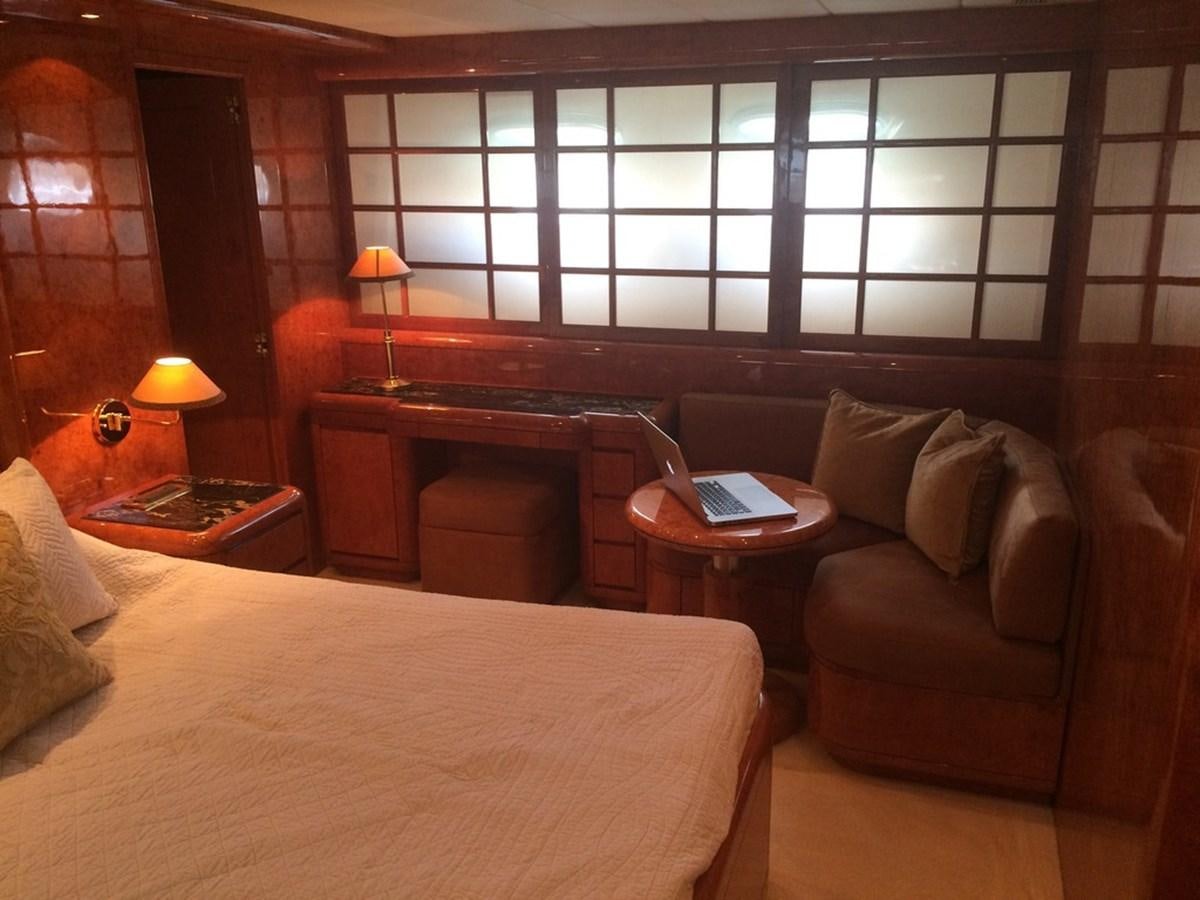 a hotel room with a laptop on the table aboard BIRD OF PREY  Yacht for Sale