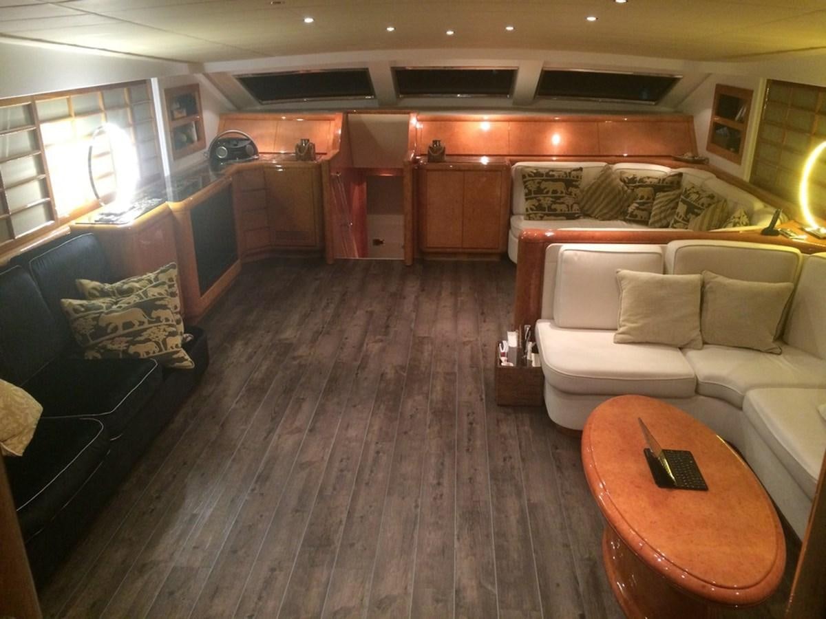 a living room with a wood floor aboard BIRD OF PREY  Yacht for Sale
