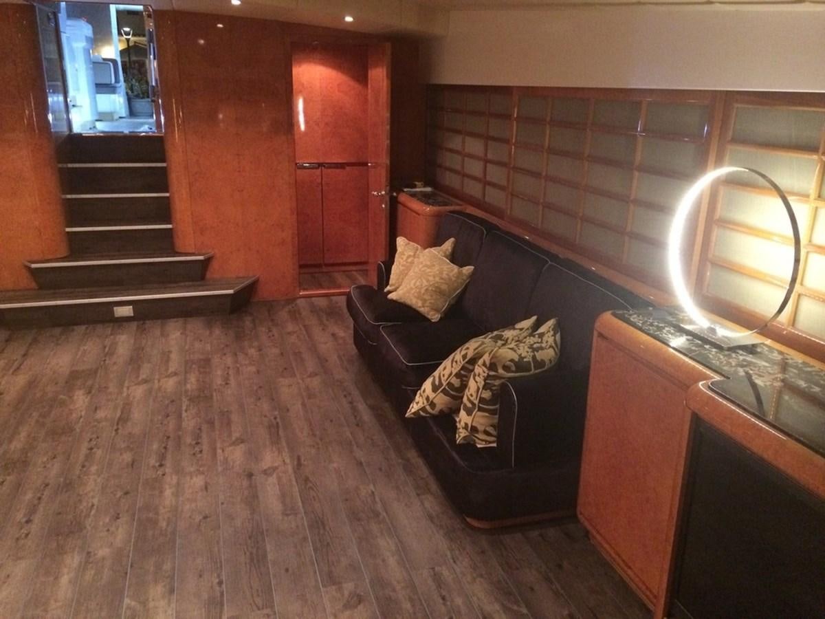 a room with a couch and a fireplace aboard BIRD OF PREY  Yacht for Sale
