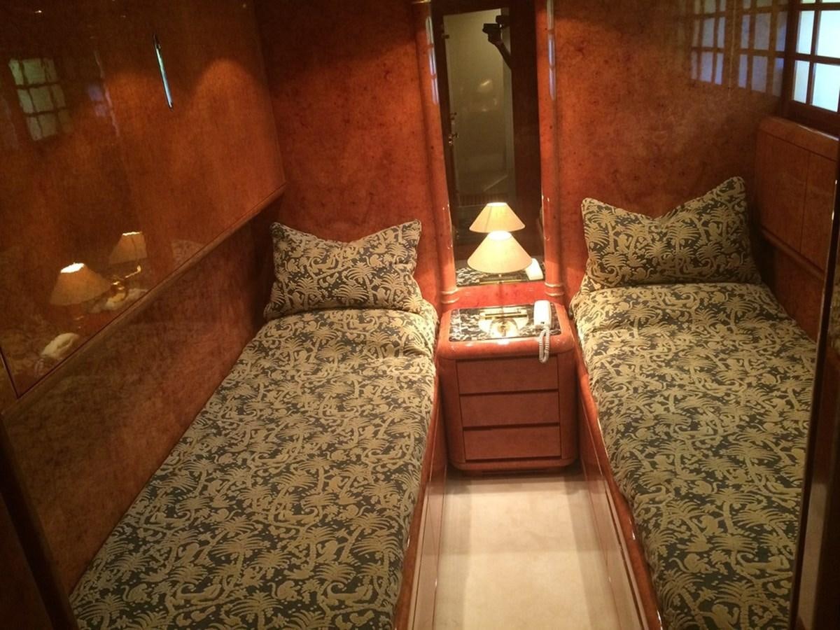a bedroom with two beds aboard BIRD OF PREY  Yacht for Sale