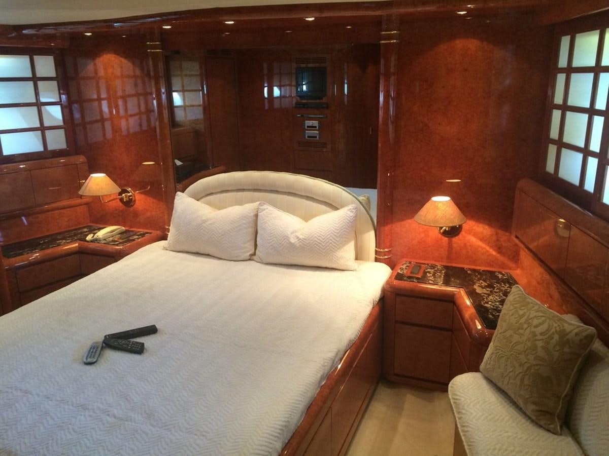 a bed with pillows and a phone aboard BIRD OF PREY  Yacht for Sale