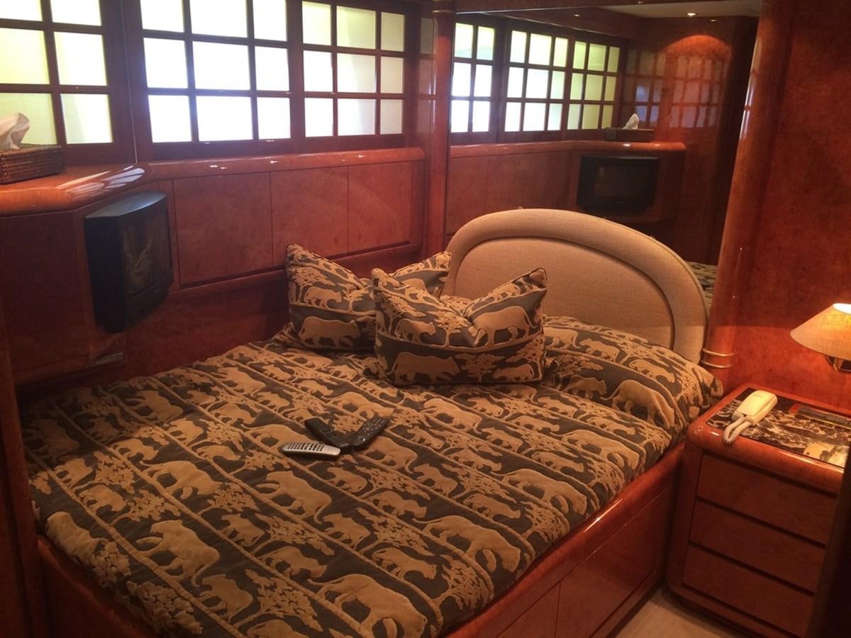 a bed with a blanket and a pillow on it aboard BIRD OF PREY  Yacht for Sale