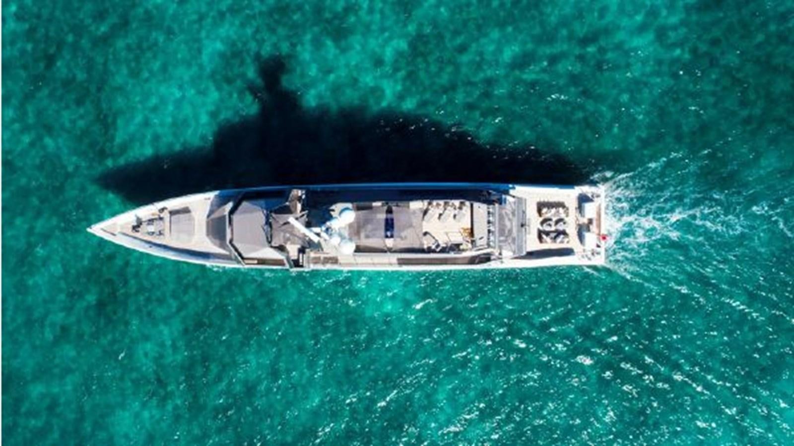 a helicopter flying over a field aboard 174 OCEANFAST MOTOR YACHT Yacht for Sale