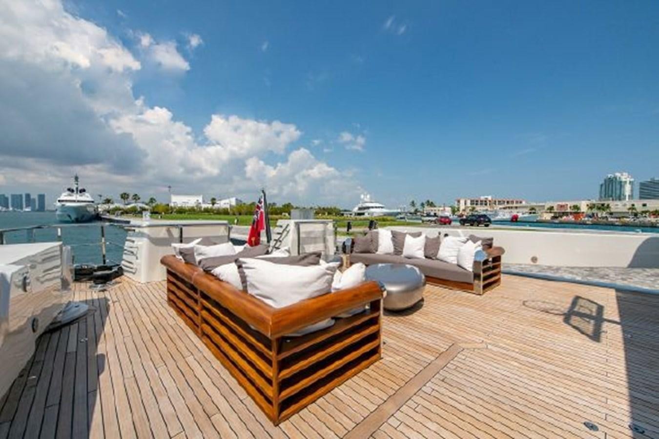 a deck with a view of a city and water aboard 174 OCEANFAST MOTOR YACHT Yacht for Sale