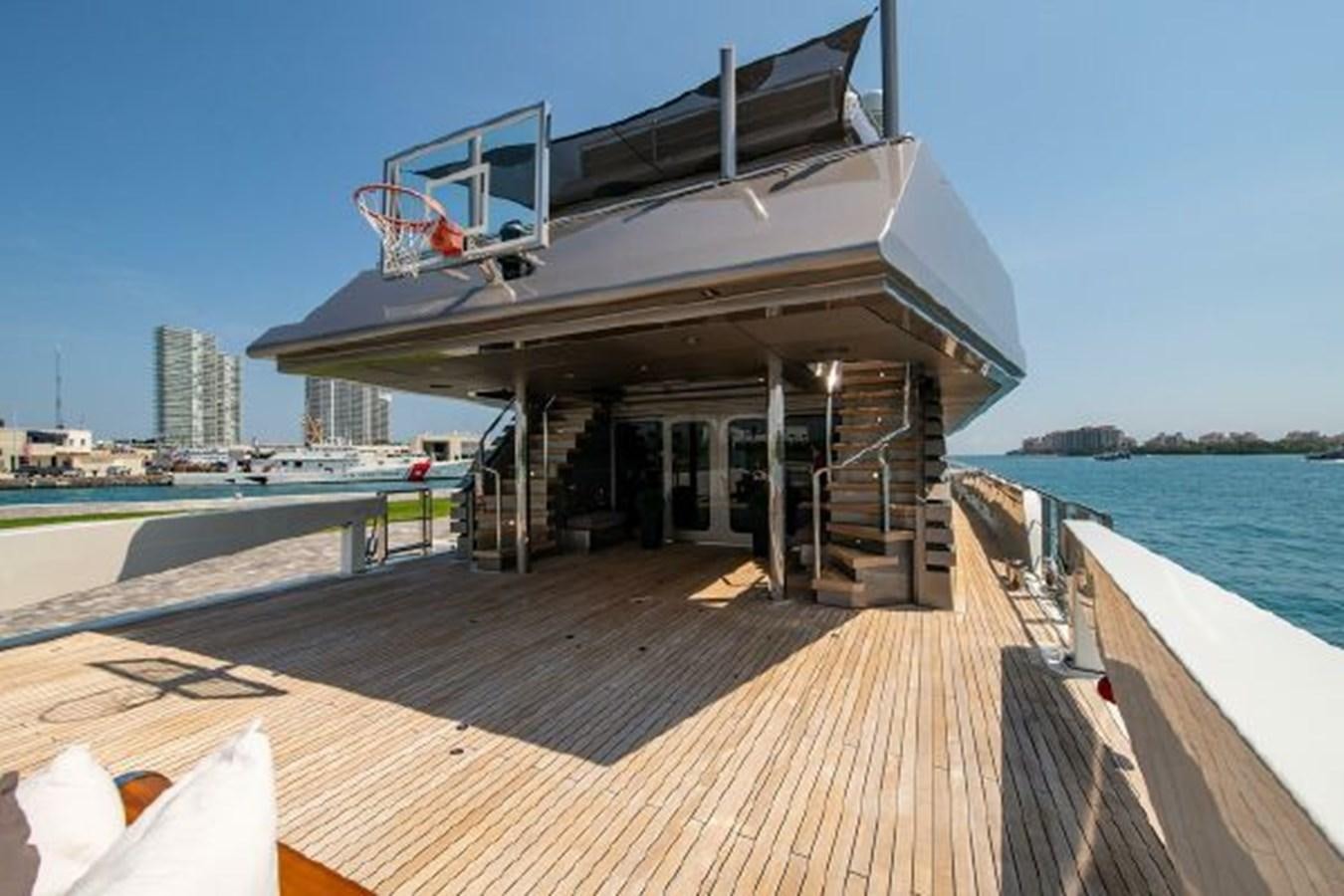 a dock with a building and a body of water in the background aboard 174 OCEANFAST MOTOR YACHT Yacht for Sale