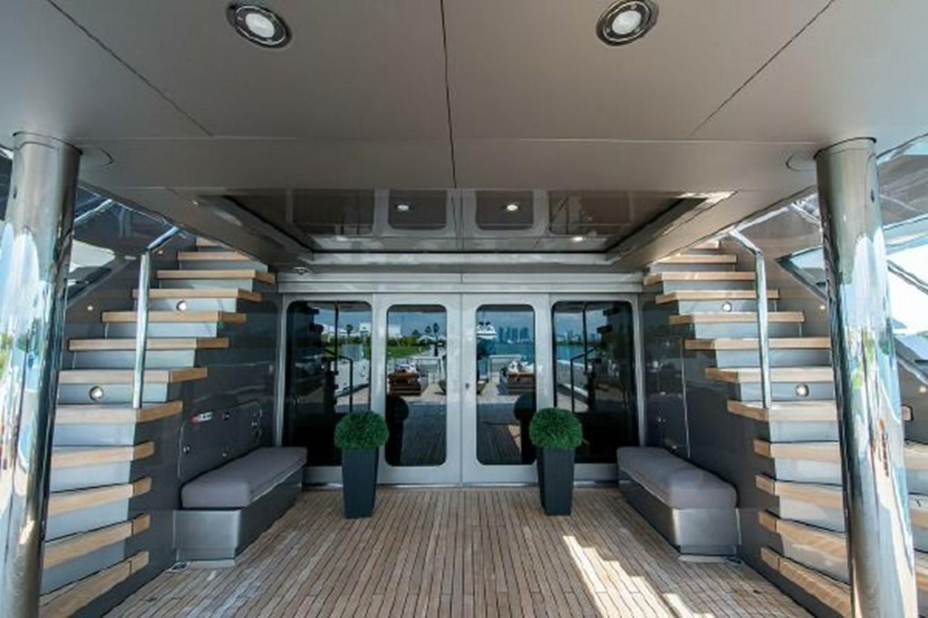 a room with a staircase and a large glass door aboard 174 OCEANFAST MOTOR YACHT Yacht for Sale