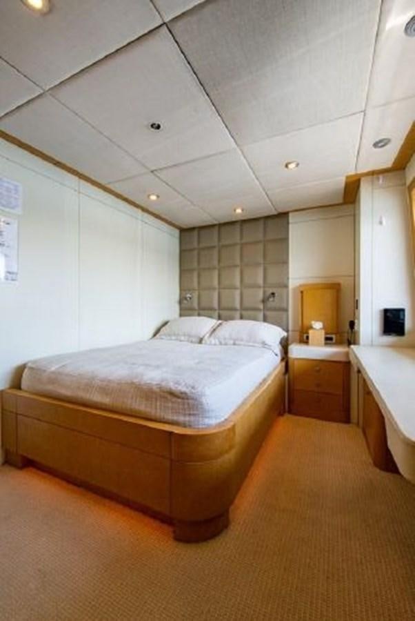 a room with a bed and a sink aboard 174 OCEANFAST MOTOR YACHT Yacht for Sale