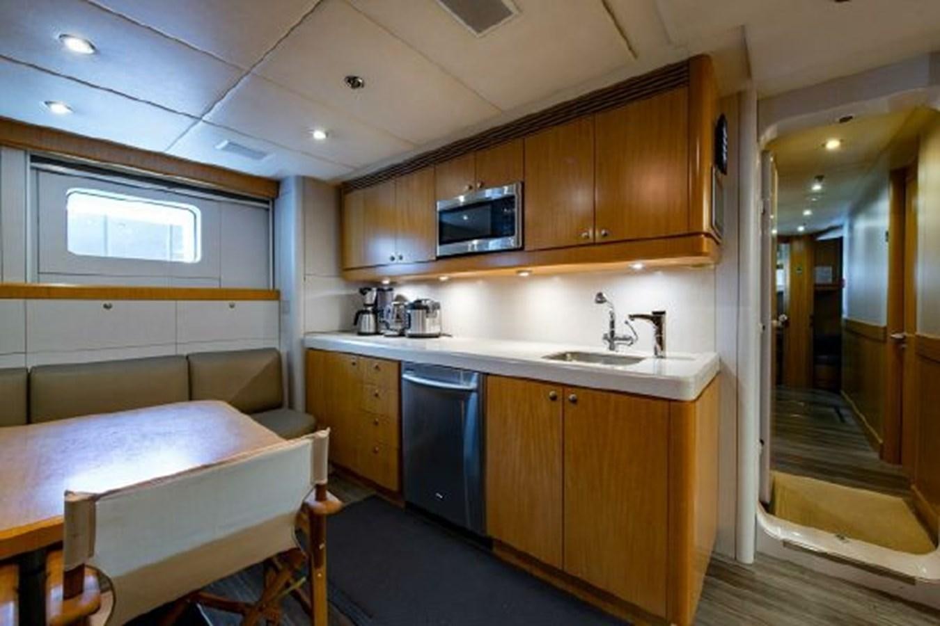 a bedroom with a bed and a sink aboard 174 OCEANFAST MOTOR YACHT Yacht for Sale