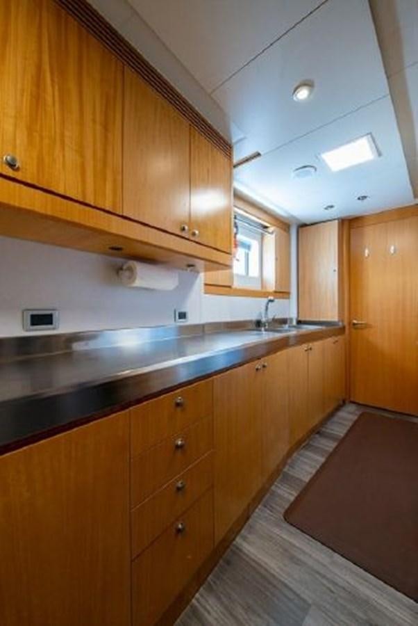 a kitchen with wooden cabinets aboard 174 OCEANFAST MOTOR YACHT Yacht for Sale