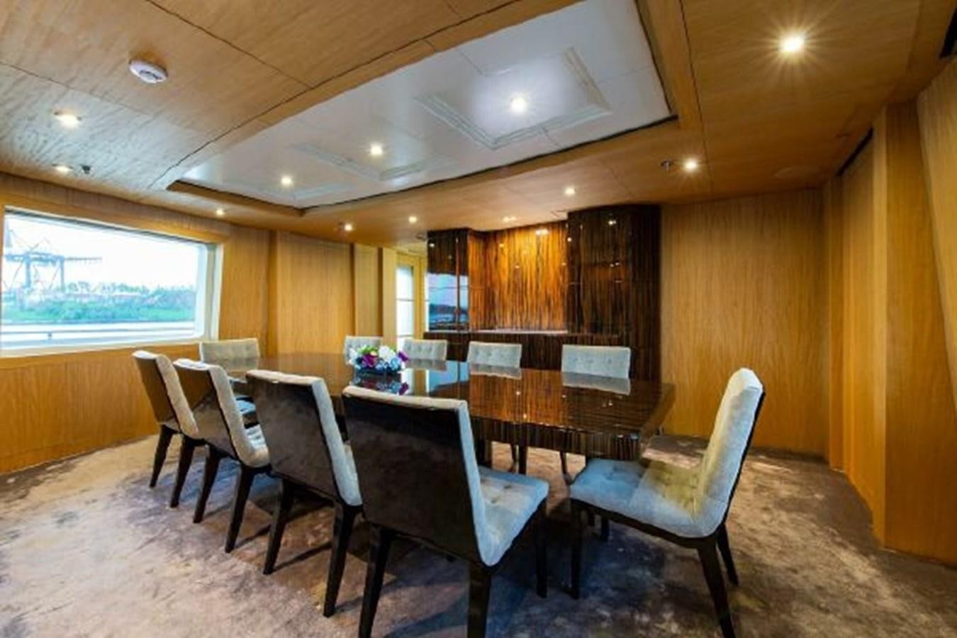 a room with tables and chairs aboard 174 OCEANFAST MOTOR YACHT Yacht for Sale