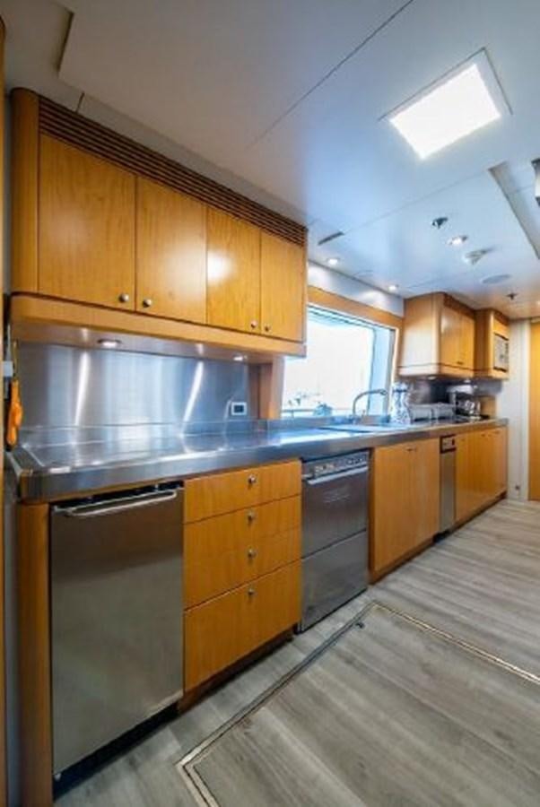a kitchen with wooden cabinets aboard 174 OCEANFAST MOTOR YACHT Yacht for Sale