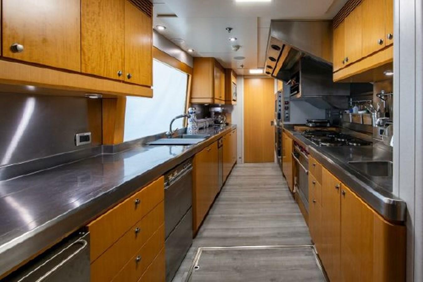 a kitchen with wooden cabinets aboard 174 OCEANFAST MOTOR YACHT Yacht for Sale