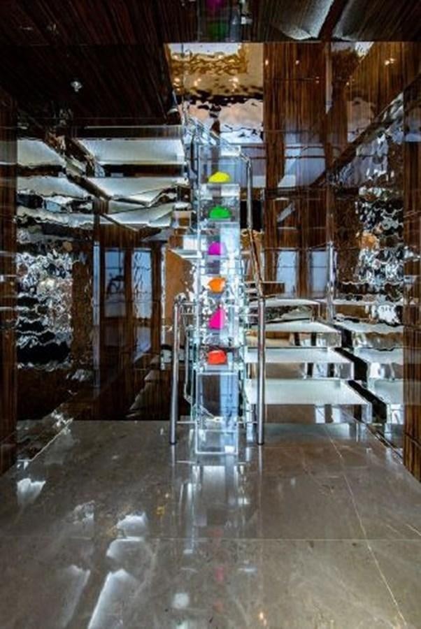 a room with a chandelier and a table aboard 174 OCEANFAST MOTOR YACHT Yacht for Sale