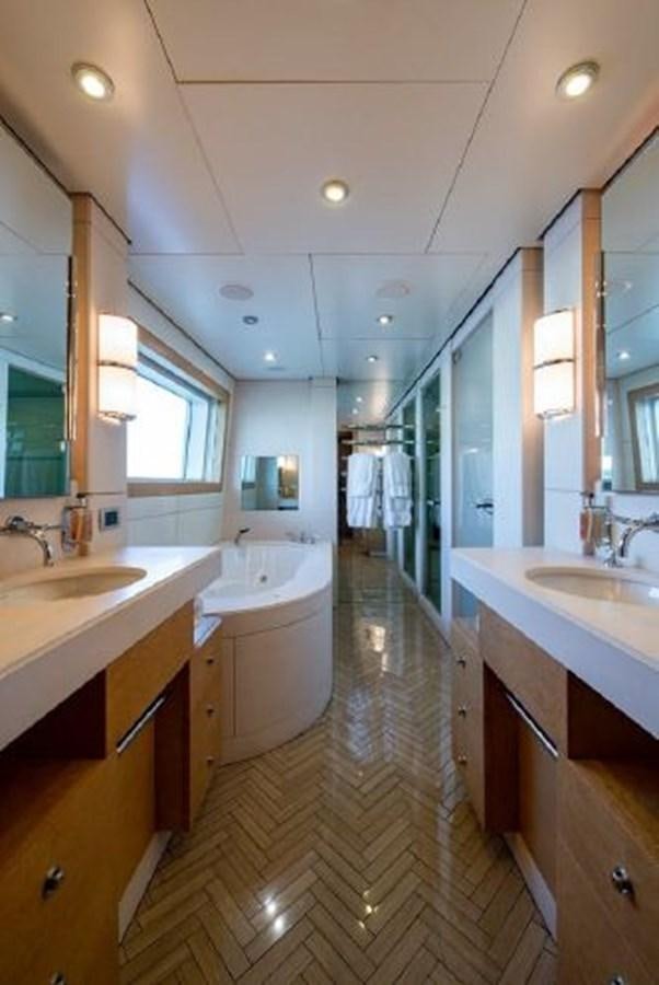 a bathroom with a tub sink and sinks aboard 174 OCEANFAST MOTOR YACHT Yacht for Sale