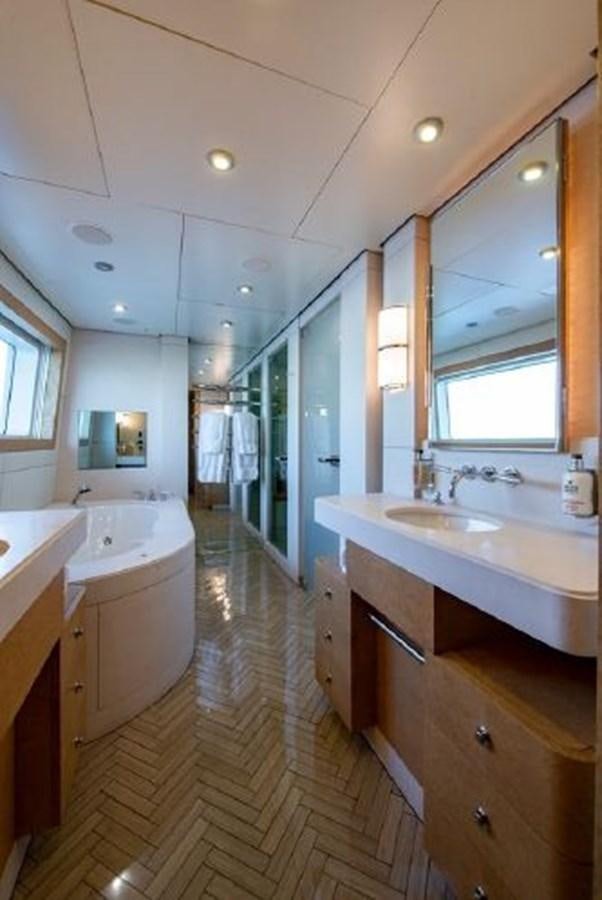 a bathroom with a tub sink and a sink aboard 174 OCEANFAST MOTOR YACHT Yacht for Sale