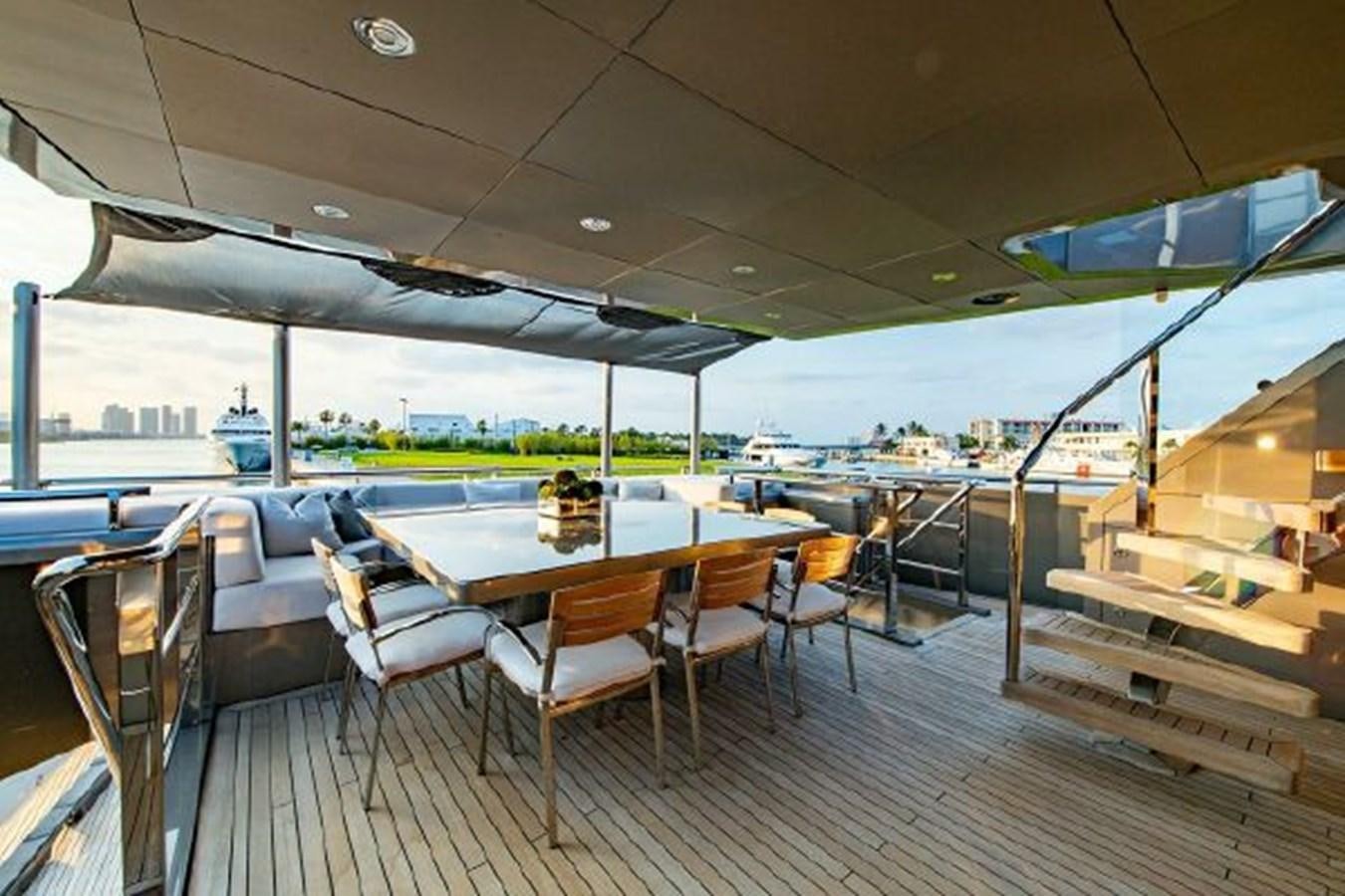 a room with a table and chairs aboard 174 OCEANFAST MOTOR YACHT Yacht for Sale