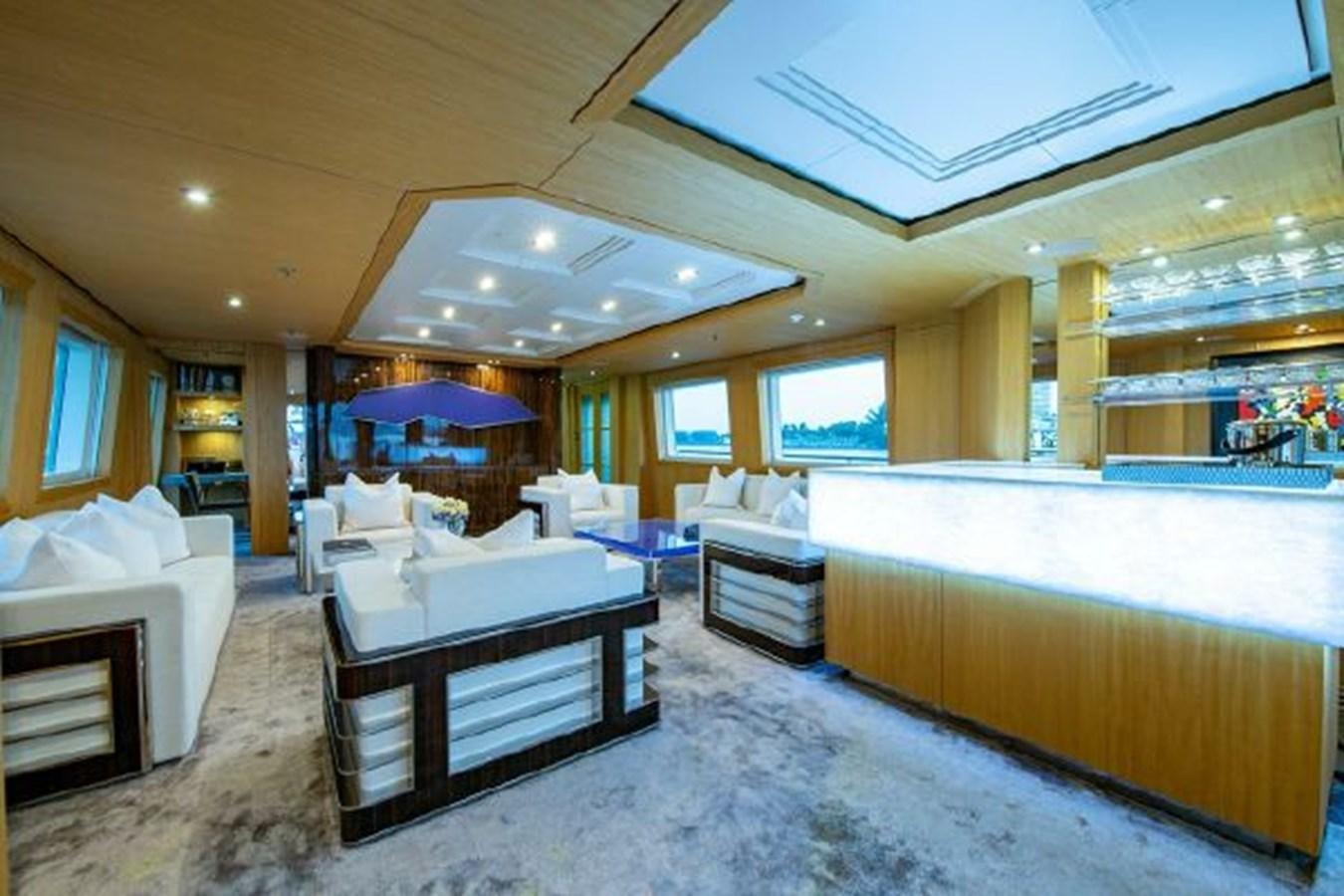a large room with a bed and a table aboard 174 OCEANFAST MOTOR YACHT Yacht for Sale