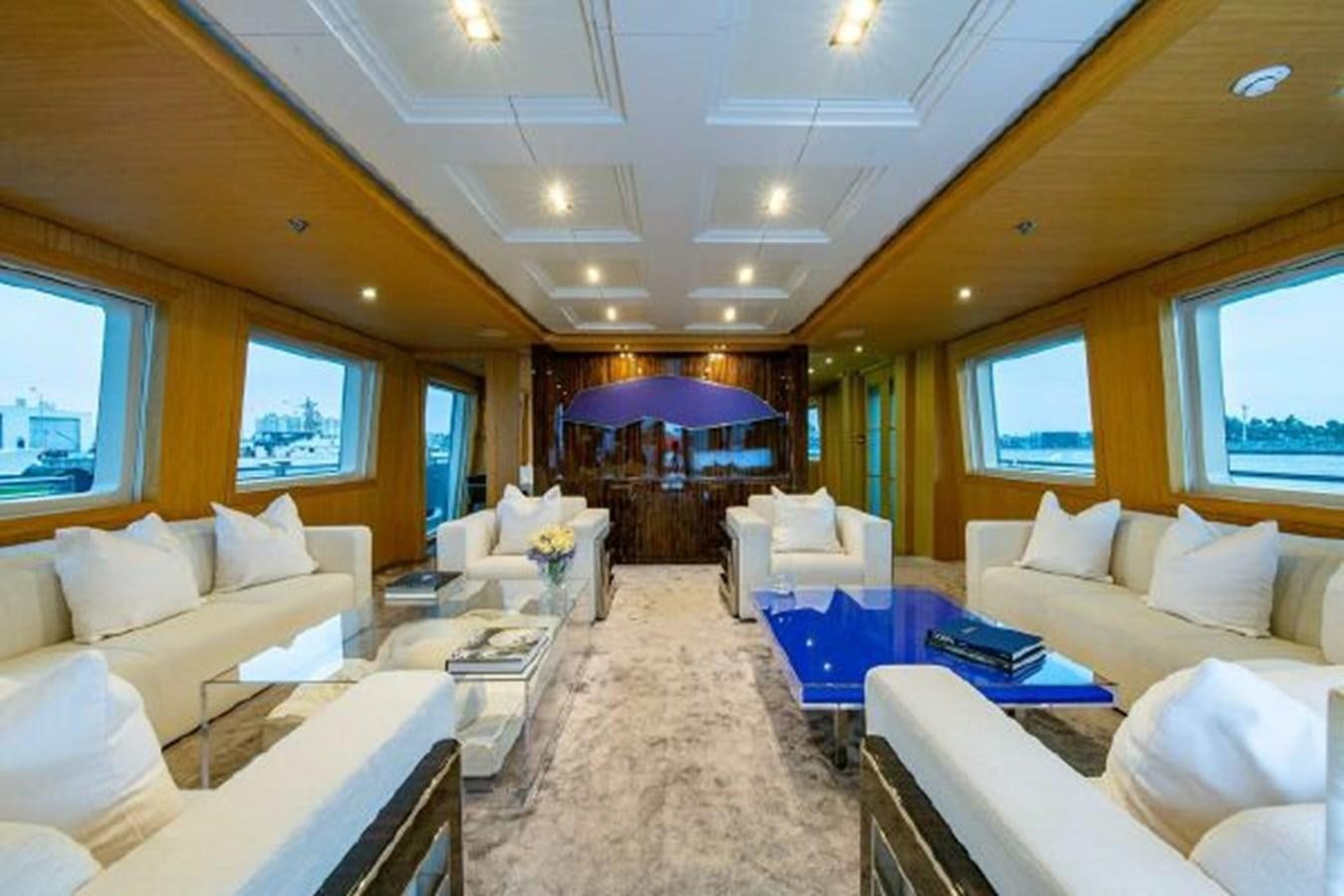 a living room with a couch and a table aboard 174 OCEANFAST MOTOR YACHT Yacht for Sale