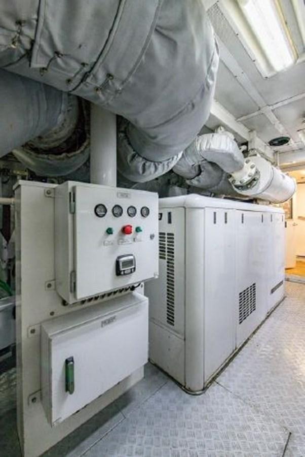 a person in a white coat aboard 174 OCEANFAST MOTOR YACHT Yacht for Sale