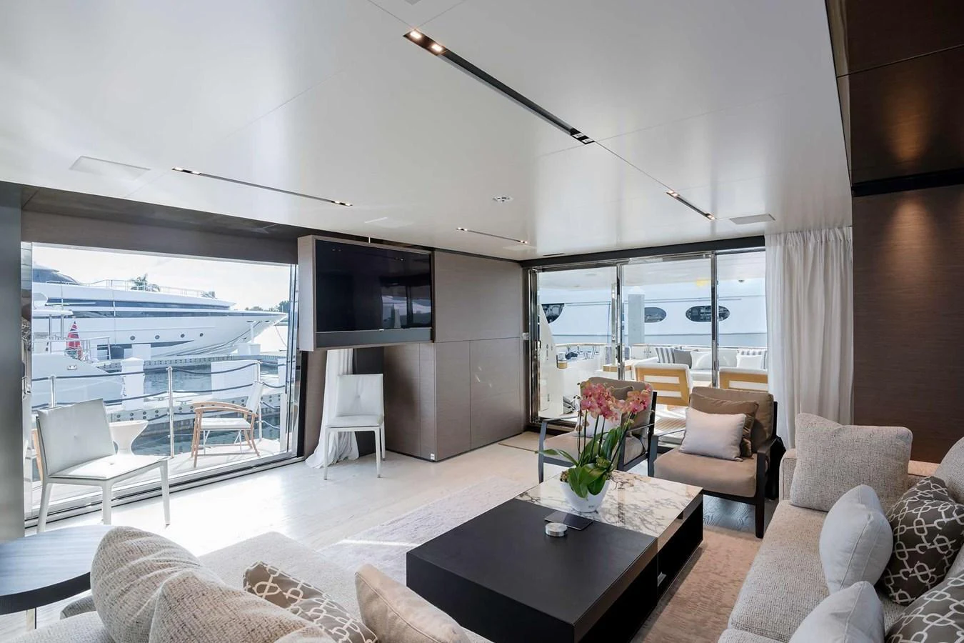 a living room with a large window aboard GIOIA Yacht for Sale