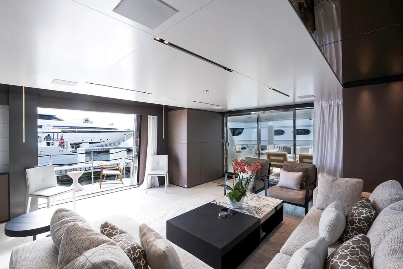 a living room with a large window aboard GIOIA Yacht for Sale