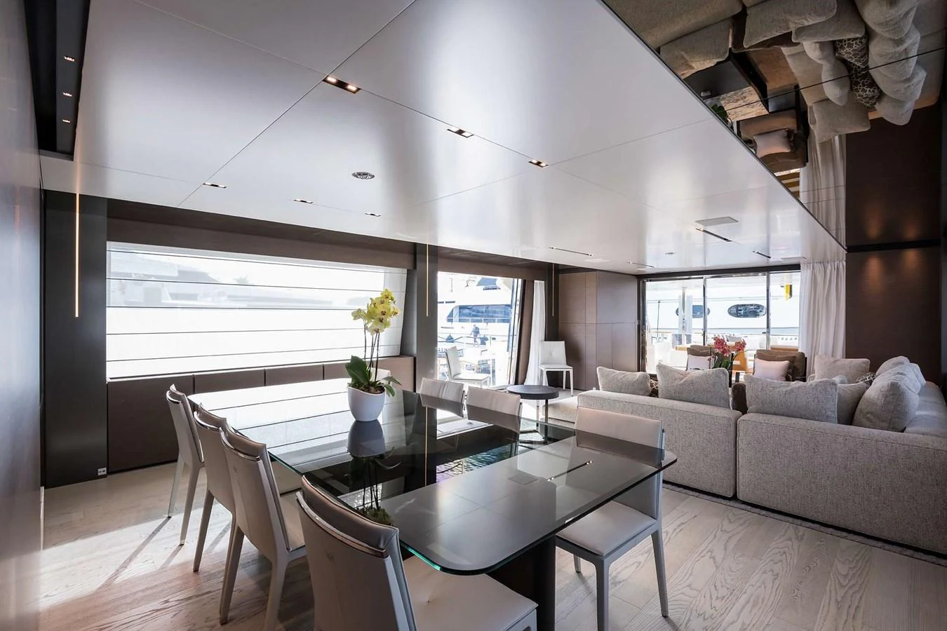 a living room with a couch and a table aboard GIOIA Yacht for Sale