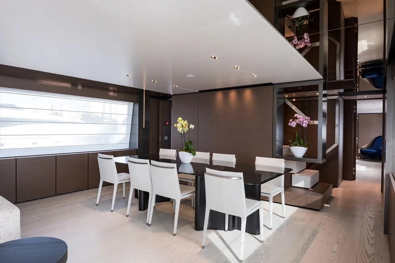 a room with a table chairs and a window aboard GIOIA Yacht for Sale