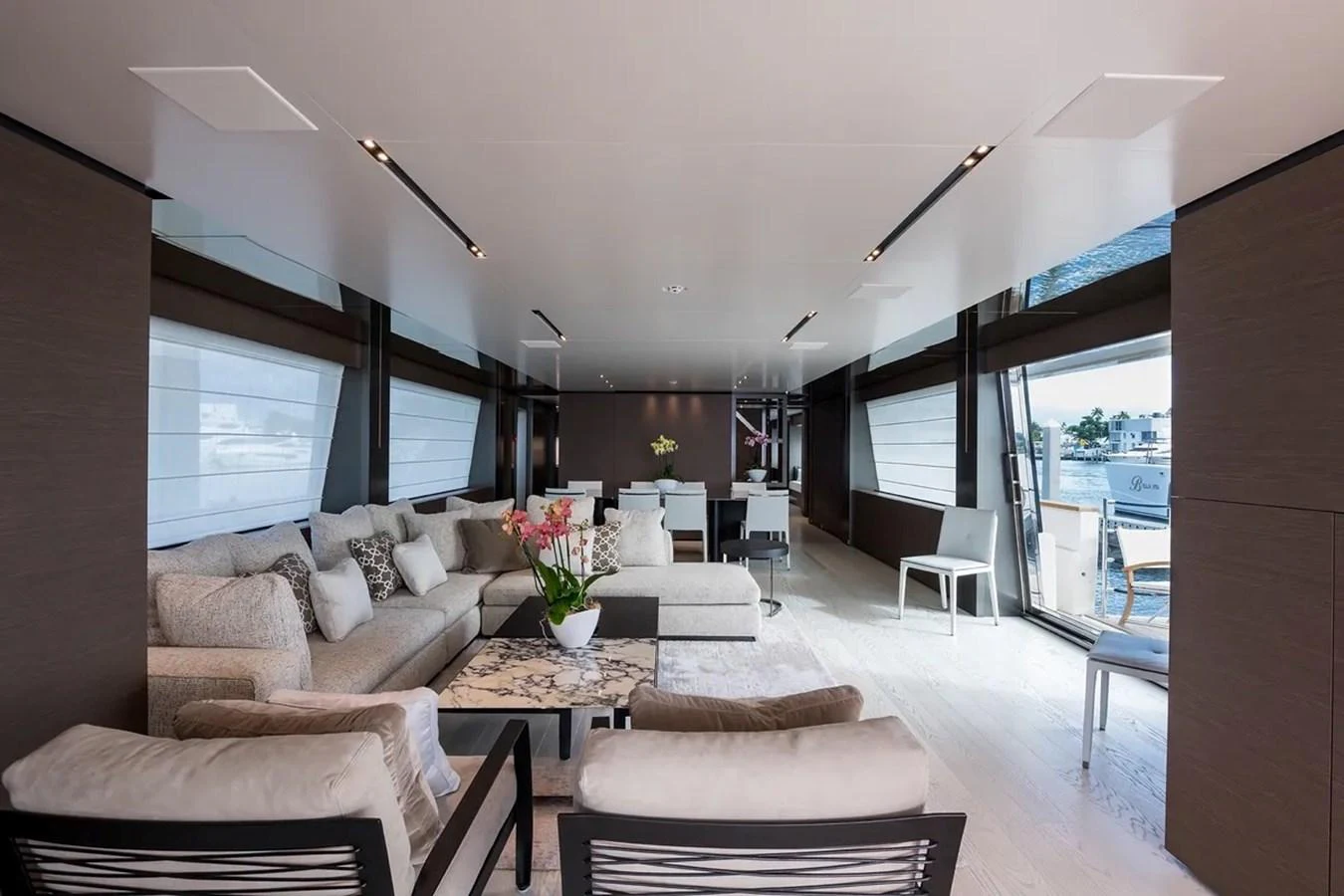 a living room with a large window aboard GIOIA Yacht for Sale
