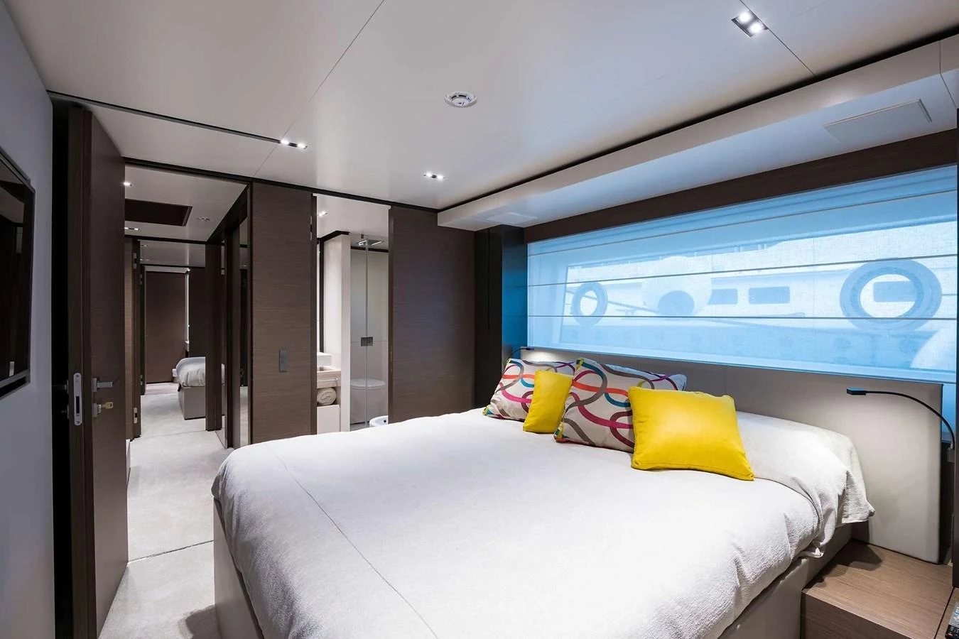 a room with a bed and a large screen aboard GIOIA Yacht for Sale