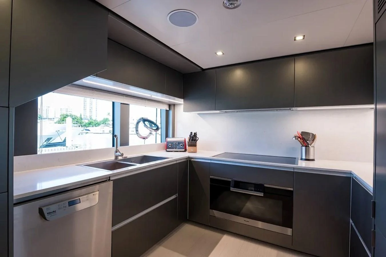 a kitchen with a stove and a sink aboard GIOIA Yacht for Sale