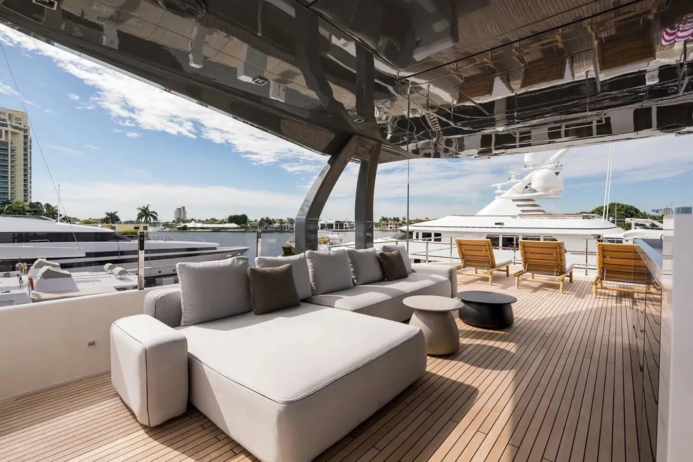 a large living room with a large deck overlooking a large body of water aboard GIOIA Yacht for Sale