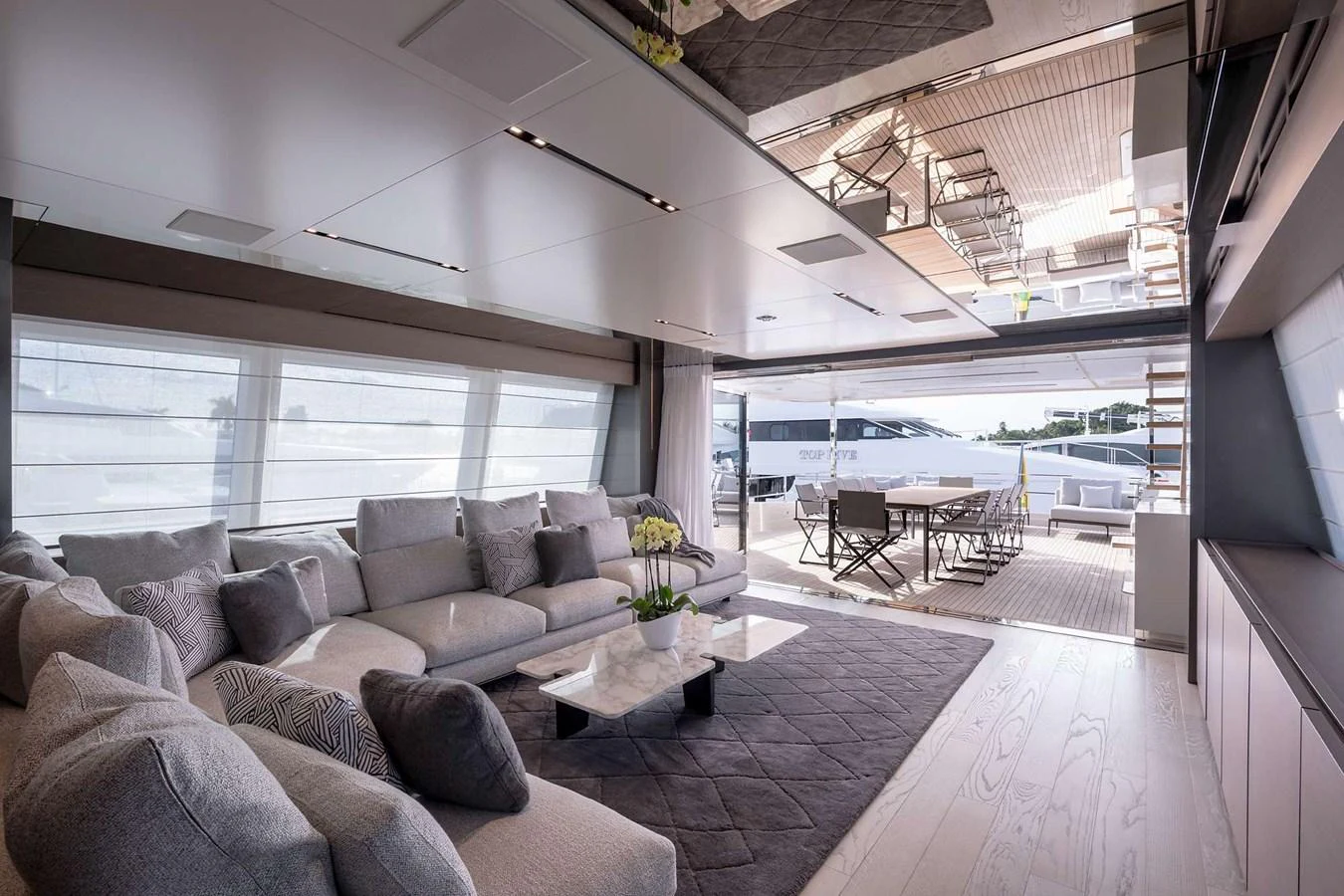 a living room with a large window aboard GIOIA Yacht for Sale