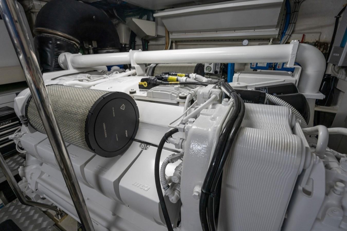 a close-up of a car engine aboard NAMEDROPPER Yacht for Sale