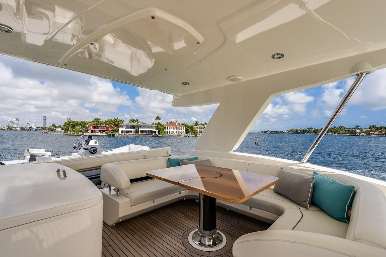 a room with a table and chairs aboard NAMEDROPPER Yacht for Sale